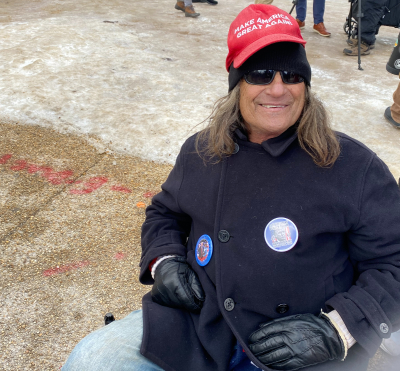 Robert Manley of Thomaston, Georgia sits on the National Mall to celebrate the inauguration of Donald Trump as the 47th president of the United States, Jan. 20, 2025. 