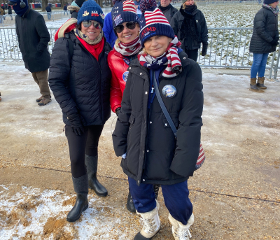 Connie, Jessica and Chach from Tampa, Florida gather on the National Mall to celebrate the inauguration of Donald Trump as the 47th president of the United States, Jan. 20, 2025. 