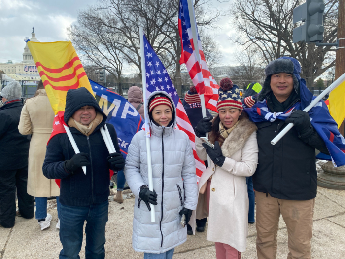 Tuan Trong (right) gathers on the National Mall to celebrate the inauguration of Donald Trump as the 47th president of the United States, on Jan. 20, 2025. 