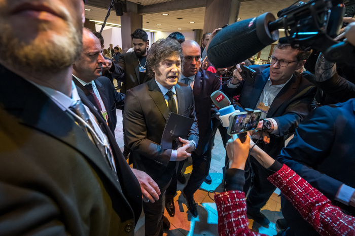 Argentina's President Javier Milei (C) addresses media during the World Economic Forum (WEF) annual meeting in Davos, Switzerland, on Jan. 23, 2025. Milei said at a Bloomberg event on Jan. 22 that 'The world should celebrate the arrival of President Trump, 'before Donald Trump will star on January 23, 2025 in an eagerly-anticipated online appearance at the World Economic Forum in Davos, addressing global elites whose annual gabfest has been consumed by the U.S. president's days-old second term. 