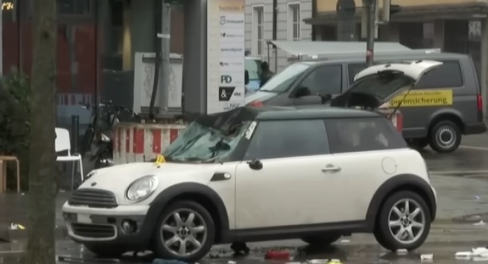 A car sits at the scene in Munich, Germany, on Feb. 13, 2025, after dozens were injured in an apparent attack that prosecutors say may have had an 'Islamist' motive.