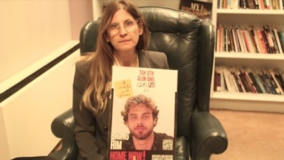 Idit Ohel holds up a photo of her son, Alon Ohel, who has spent over 500 days as a hostage of Hamas. The mother spoke with The Christian Post on Feb. 25, 2025, in Washington, D.C., about her son's condition in captivity. 