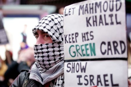 Pro-Palestinian activists participate in a 'Fight for our Rights' rally and in support of Mahmoud Khalil, in New York's Times Square on March 15, 2025. Khalil, a recent graduate and one of the most prominent faces of the university's high-profile protests, was arrested by US immigration officials over the weekend despite holding a permanent residency green card. Protesters in New York and rights groups have expressed outrage over the arrest of Khalil, a leader of pro-Palestinian demonstrations at Columbia University, as President Donald Trump vowed further crackdowns. 
