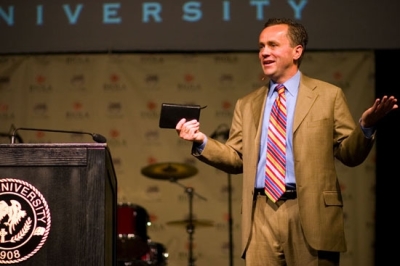 Dr. Barry Corey speaks at a Biola University chapel on May 8. More than 2,000 students, faculty and staff attended the chapel. Corey was recently announced as the new president of Biola.