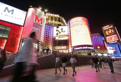 Tourists walk past the Planet Hollywood Resort & Casino in Las Vegas, Wednesday, Nov. 14, 2007.