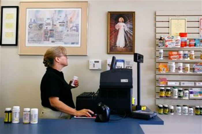 Pam Semler, of Fairfax, Va., works the register at DMC Pharmacy in Chantilly, Va. on Monday, Oct. 20, 2008. The pharmacy bills itself as 'pro-life' and carries no contraceptive products. Divine Mercy Care Pharmacy is among at least seven pharmacies across the nation that is refusing as a matter of faith to sell contraceptives of any kind, even if a person has a prescription.