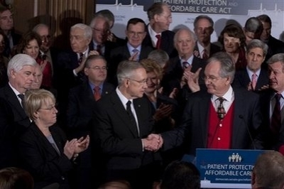 Senate Majority Leader Harry Reid of Nev., accompanied by Senate Democrats, accepts congratulations from Senate Health, Education, Labor and Pensions Committee Chairman Sen. Tom Harkin, D-Iowa during a health care news conference on Capitol Hill in Washington, Wednesday, Dec. 23, 2009. From lefty are, Senate Banking Committee Chairman Sen. Christopher Dodd, D-Conn, Sen. Patty Murray, D-Wash. Sen. Robert Menendez, D-N.J., Reid, Sen. Debbie Stabenow, D-Mich., Harkin, and Senate Finance Committee Chairman Sen. Max Baucus, D-Mont.