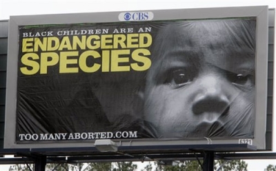 In this photo made Thursday, Feb. 11, 2010, an anti-abortion billboard is shown in Atlanta. The eyebrow-raising ads featuring a young black child are an effort by the anti-abortion movement to use race to rally support within the black community. The reaction from black leaders has been mixed, but the 'Too Many Aborted' campaign, which so far is unique to only Georgia, is drawing support from other anti-abortion groups across the country.