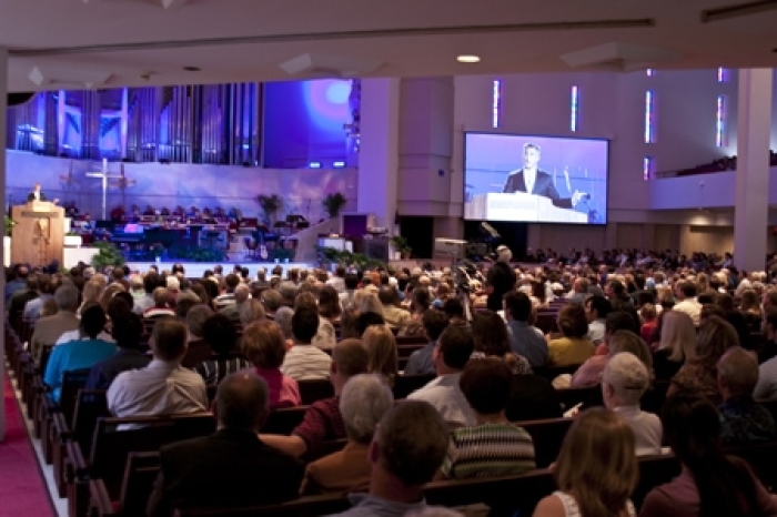 In this file photo, thousands attend a Sunday worship service at Coral Ridge Presbyterian Church in Fort Lauderdale, Fla.