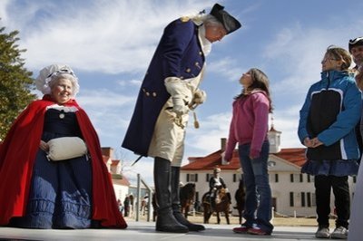 Mary Wiseman, left, portraying Mary Washington, listens as Dean Malissa, portraying America's first president, Gen. George Washington, is asked 'Where is Molly Pitcher?' by Megan Schuh, and her sister Jenna Schuh, right, at Mount Vernon, Washington's historic home in Mt. Vernon, Va. Sunday, Feb. 20, 2011. Monday the nation celebrates the president's 279th birthday. Three days of events over the President's Day weekend are taking place on the estate, which is located on the banks of the Potomac River, just south of the nation's capital.