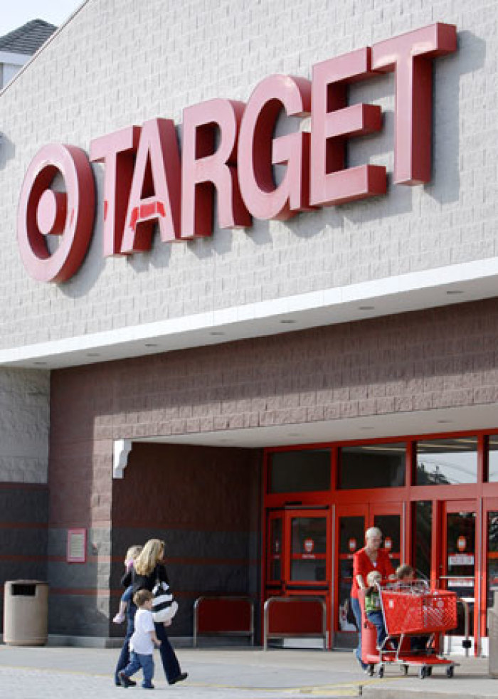 In this Oct. 5, 2009 photo, shoppers enter and exit the Target store in Salem, N.H.