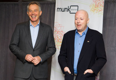 In this file photo, former British Prime Minister Tony Blair (L) and author Christopher Hitchens pose ahead of their debate on religion set up by 'Munk Debates' in Toronto, November 26, 2010.