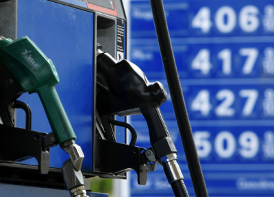 Gas and diesel pumps along with gas prices are shown at an Exxon gas station in Carlsbad, California.