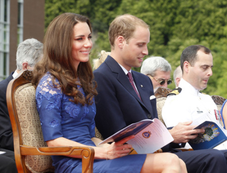 Britain's Prince William and his wife Catherine, Duchess of Cambridge, take part in a prayer service on board the HMCS Montreal in Quebec City July 3, 2011. Prince William and his wife Catherine are on a royal tour from June 30 to July 8.