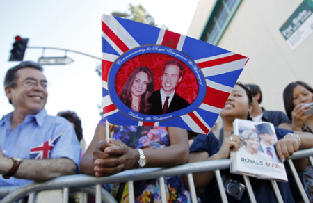 Bystanders wait for Britain's Prince William and his wife Catherine, Duchess of Cambridge, to arrive at the BAFTA Brits to Watch event in Los Angeles, California July 9, 2011. Prince William and his wife are on a royal visit to California from July 8 to July 10.