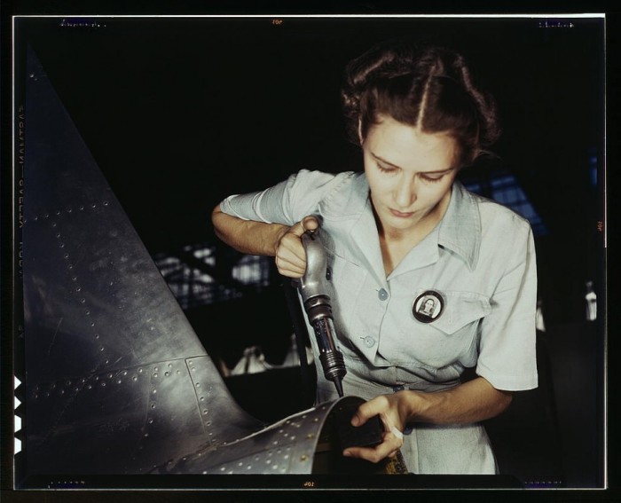 Answering the nation's need for womanpower, Mrs. Virginia Davis made arrangement for the care of her two children during the day and joined her husband at work in the Naval Air Base, Corpus Christi, Texas. 