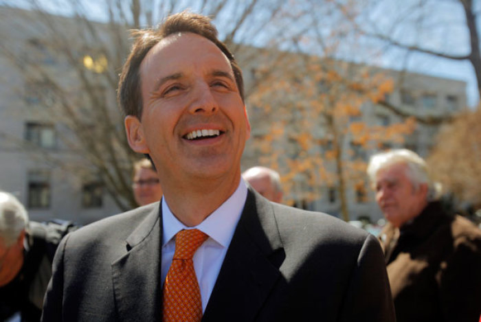 Former Minnesota Governor and Republican Presidential candidate Tim Pawlenty listens as he is introduced at a Tax Payer Tea Party Rally in Concord, New Hampshire April 15, 2011.