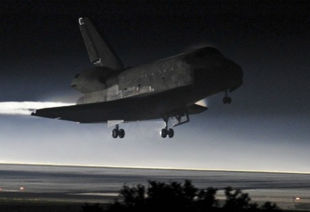 Space shuttle Atlantis lands at the Kennedy Space Center in Cape Canaveral, Florida, July 21, 2011. The space shuttle Atlantis glided home through a moonlit sky for its final landing at the Kennedy Space Center in Florida on Thursday, completing a 30-year odyssey for NASA's shuttle fleet.