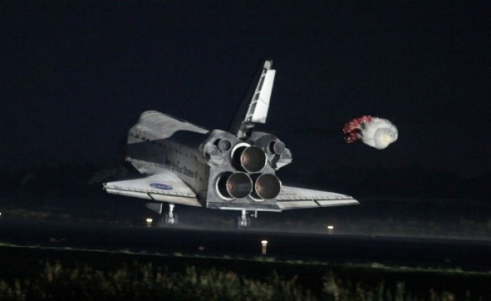 Space shuttle Atlantis lands at the Kennedy Space Center in Cape Canaveral, Florida, July 21, 2011. The space shuttle Atlantis glided home through a moonlit sky for its final landing at the Kennedy Space Center in Florida on Thursday, completing a 30-year odyssey for NASA's shuttle fleet.