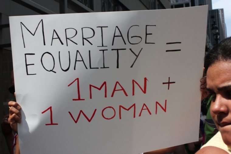 A protester at the 'Let the People Vote' rally in Manhattan on July 24, 2011 holds up a sign to protest New York's gay marriage law. Thousands participated in the multi-city rally which called on state lawmakers to put the gay marriage issue before voters through a statewide referendum.