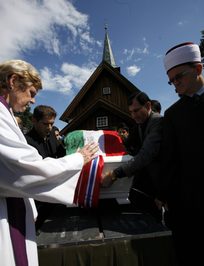 Christian cleric Anne Marie Tronvik (L) and Senaid Kobilica (R), chairman of the Islamic Council of Norway, prepare for the funeral ceremony of Bano Rashid, 18, at Nesodden church near Oslo July 29, 2011, as the nation pauses for memorial services after the worst attacks on the nation since World War Two. Norway is holding the first funeral on Friday for a victim of Anders Behring Breivik's massacre of 76 people a week ago amid signs of a leap in popularity for the ruling Labour Party that was his main target. Flags around the nation flew at half mast to mark a day of memorial one week after Breivik, an anti-Islam zealot, set off a bomb in central Oslo that killed 8 people. He then shot 68 people at a summer camp for youths of the ruling Labour Party.