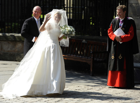 Britain's Zara Phillips, the eldest granddaughter of Queen Elizabeth, arrives with Captain Mark Phillips, for her marriage to England rugby captain Mike Tindall, at Canongate Kirk in Edinburgh, Scotland July 30, 2011.