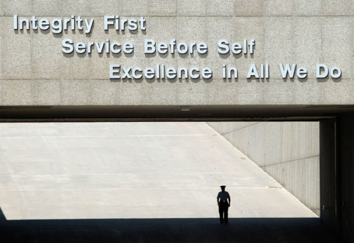 A cadre waits for the next load of basic cadets during in-processing for cadets at the U.S. Air Force Academy in Colorado Springs, Colorado, June 28, 2007.