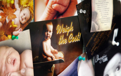 Pictures of babies and pro life slogans fill the bulletin board in Janet Lyons' office at Alternatives Pregnancy Center seen in this undated photo.