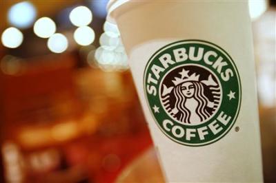 A cup of Starbucks coffee sits on a table in a cafe in central Hong Kong January 16, 2011.