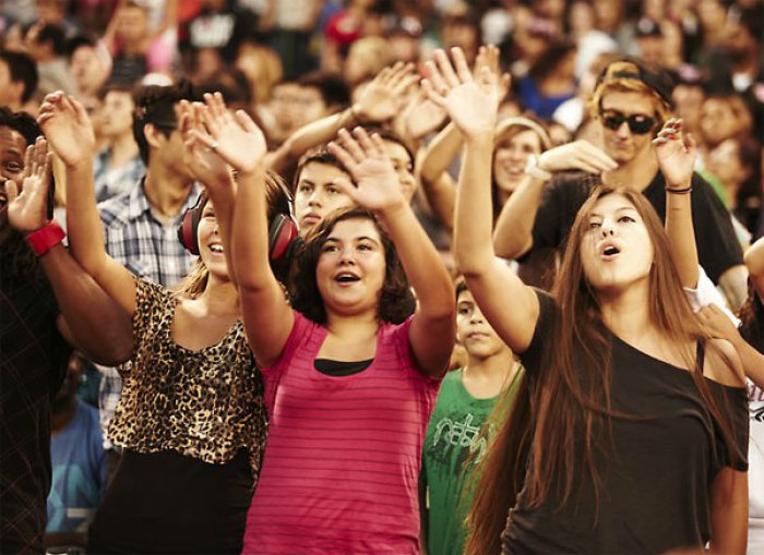 Thousands worship at Angel Stadium in Anaheim, Calif., during the 2011 Harvest Crusade. A total of 115,000 attended the evangelistic event, held Aug. 12-14. More than 12,000 people made decisions for Christ over the three days.