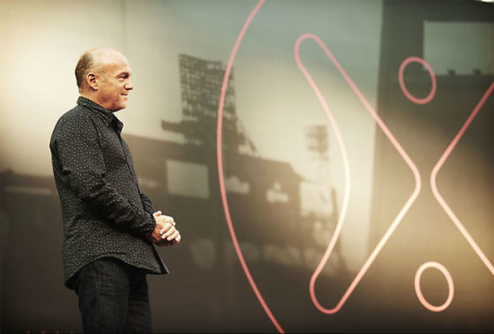 Evangelist Greg Laurie stands on stage at the 2011 Harvest Crusade in Anaheim, Calif. A total of 115,000 attended the evangelistic event, held Aug. 12-14. More than 12,000 people made decisions for Christ over the three days.