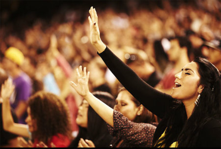 Thousands worship at Angel Stadium in Anaheim, Calif., during the 2011 Harvest Crusade. A total of 115,000 attended the evangelistic event, held Aug. 12-14. More than 12,000 people made decisions for Christ over the three days.