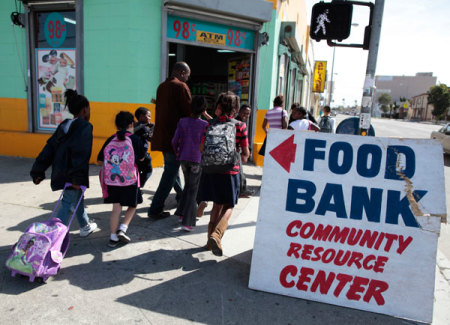 Regional coordinator Charles Evans (4th L) picks up children from school to take them to an after-school program at South Los Angeles Learning Center in Los Angeles, California March 16, 2011. The center is run by School on Wheels, which uses volunteers to tutor homeless children in shelters, parks, motels, and two centers. There has been a surge in the number of homeless children in Los Angeles in the last five years, due to persistent unemployment and mounting foreclosures.