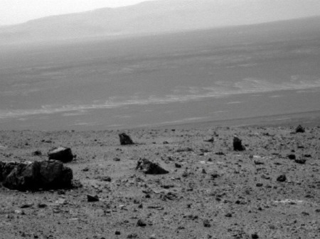 NASA's Mars Exploration Rover Opportunity used its panoramic camera to capture this raw image looking across Endeavour crater during the rover's 2,686th Martian day, or sol, of work on Mars (Aug. 14, 2011).