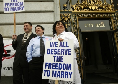 Same sex couple Terese Rowe (C) and Kristin Orbin wait to receive a marriage license application prior to a judge lifting the Proposition 8 stay on same sex marriages at City Hall in San Francisco, California. A U.S. federal judge on Thursday ruled that legal marriages of same-sex couples may resume next week in California, pending the appeal of his earlier decision that overturned a voter-approved ban on gay matrimony. August 2, 2010