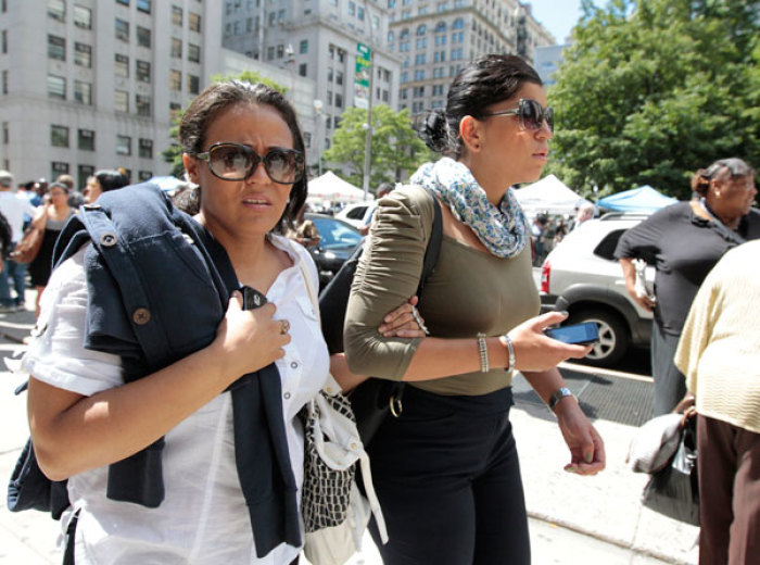 Workers are evacuated from the New York State Supreme Courthouse after an earthquake strikes the East Coast of the United States, in New York August 23, 2011.