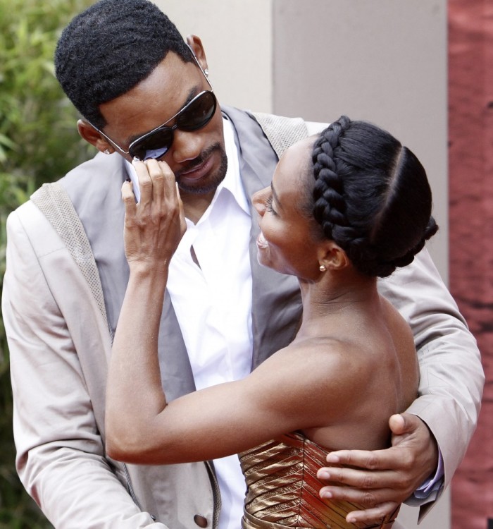 Actor Will Smith and his wife Jada Pinkett Smith attend the premiere of 'The Karate Kid' at the Mann Village theatre in Los Angeles June 7, 2010.