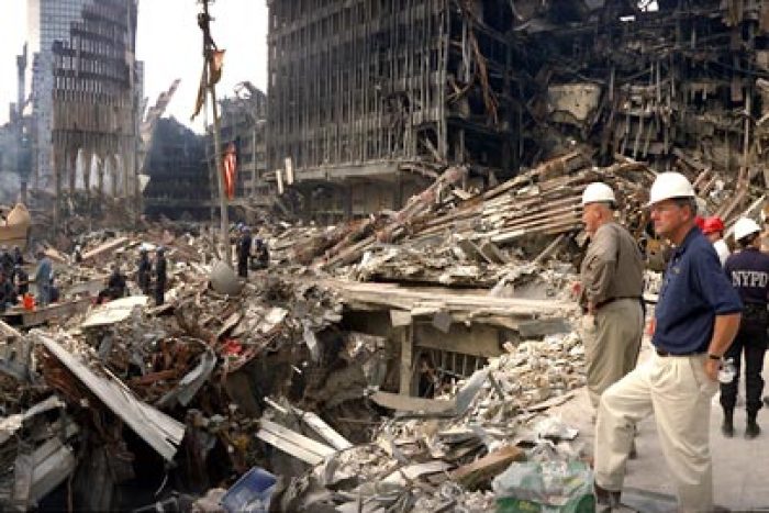 FEMA director Joe Allbaugh looks over wreckage of the World Trade Center at 'ground zero' in New York after the terrorist attack of 9/11