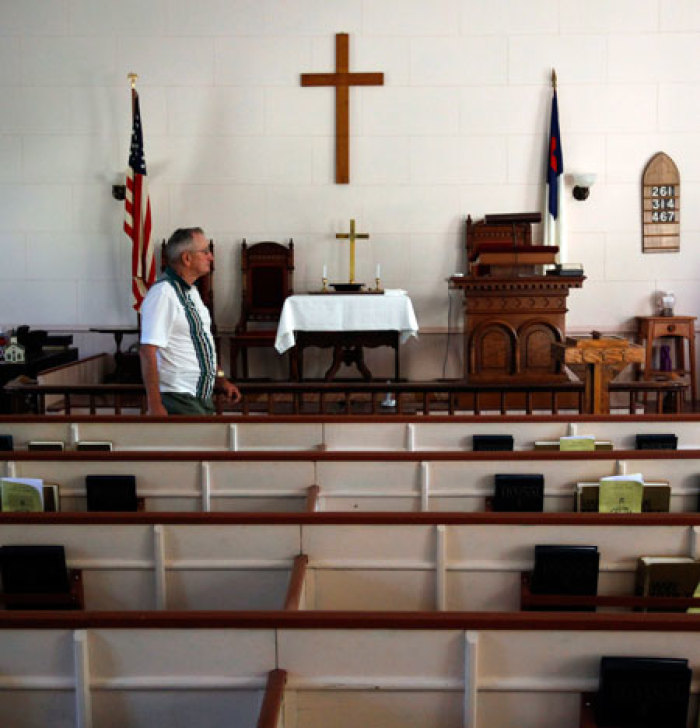 Howard Grace walks through the West Unity Community United Methodist Church in Unity, New Hampshire July 5, 2011.