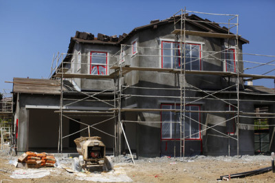 A new residential home is shown under construction in Carlsbad, California September 19, 2011. U.S. homebuilder sentiment dipped in September with an industry index mired in a low range as the housing market continues to struggle, the National Association of Home Builders said on Monday.