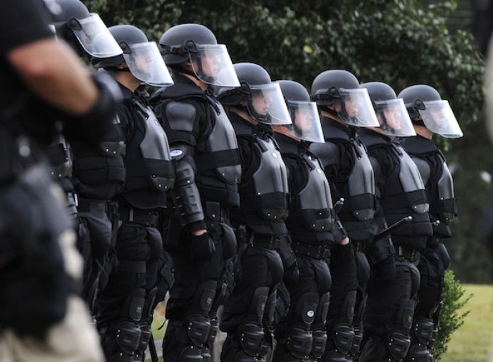 Members of the law enforcement line up in front of supporters of convicted killer Troy Davis after some activists became rowdy at the Georgia Diagnostic and Classification prison where Davis is set to be executed by lethal injection in Jackson, Georgia September 21, 2011. The parole board in Georgia denied a last-ditch clemency appeal by Davis, a Georgia man set to be executed in a high-profile case for the murder of a police officer.