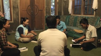 Members of a house church in a city in Indonesia gather to worship in the secrecy of someone's home, October 2011.