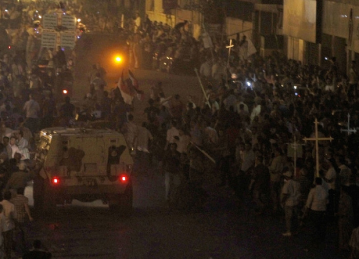 Egyptian Christians clash with soldiers and riot police during a protest against an attack on a church in southern Egypt, in Cairo October 9, 2011. 23 people were killed in Cairo when Christians, some carrying crosses and pictures of Jesus, clashed with military police.