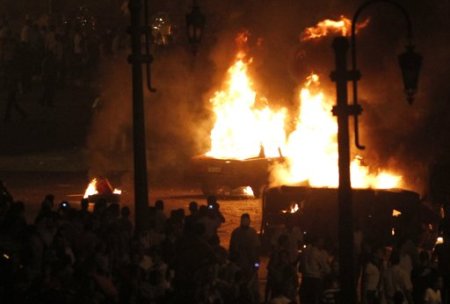 Army vehicles burned during during a protest in Cairo against the attack on a church in southern Egypt October 9, 2011. Over a dozen were killed in Cairo on Sunday when Christians, some carrying crosses and pictures of Jesus, clashed with military police, medical and security sources said, in the latest sectarian flare-up in a country in political turmoil.