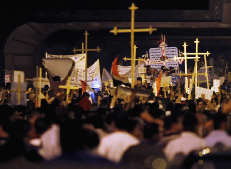 Egyptian Christians march in Cairo during a protest against an attack on a church in southern Egypt, October 9, 2011. Nineteen people were killed in Cairo on Sunday when Christians, some carrying crosses and pictures of Jesus, clashed with military police, medical and security sources said, in the latest sectarian flare-up in a country in political turmoil.