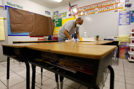 A worker is seen in a classroom inside Golden Rule Charter School, April 29, 2009.