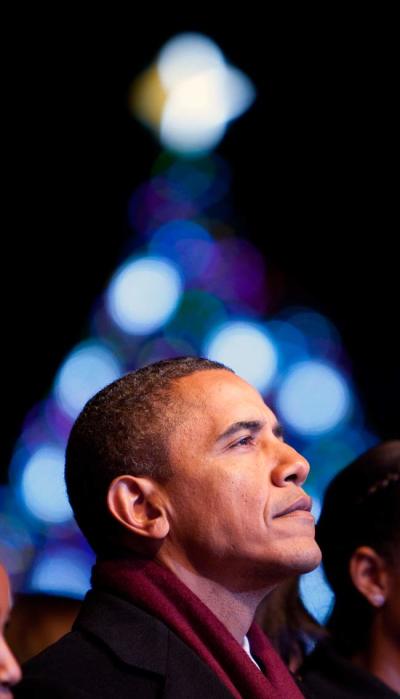 U.S. President Barack Obama watches the lighting of the National Christmas Tree in Washington December 1, 2011.