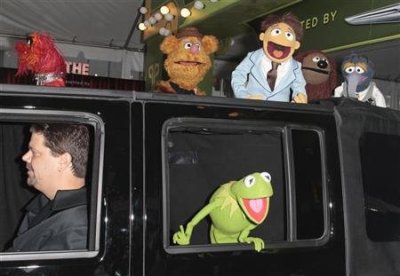 Muppets cast members Kermit the Frog, Animal (top L), Fozzie Bear (2nd L), Walter (3rd L), Rowlf (2nd R), and Gonzo (R) arrive at the 'The Muppets' world premiere in Hollywood, Calif., Nov. 12.