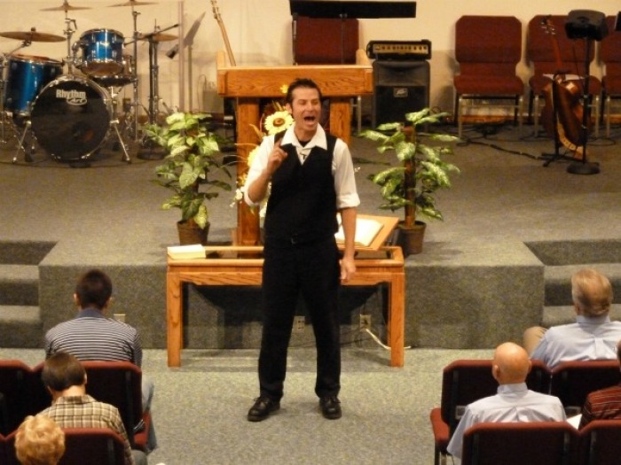 Tom Meyer recites the Bible, from memory, in front of a congregation.