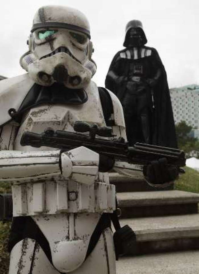 People dressed as characters from Star Wars pose during a Star Fans Celebration in Guatemala City October 2, 2011. The celebration, aimed at fans of the films, took place for the seventh consecutive year.